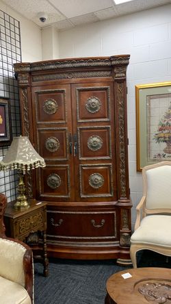 Ornate Wood Armoire with Carved Details