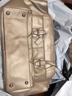 Gold coach hand bag