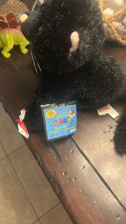 Flushed toy, black silver cat
