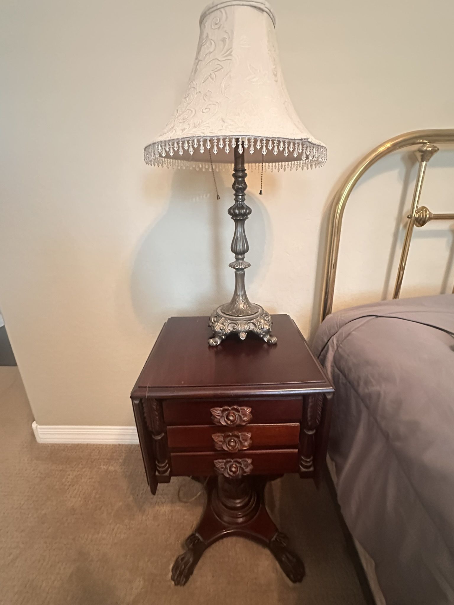 Antique mahogany drop-leaf end table with three drawers
