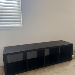 TV, living room table, storage shelves
