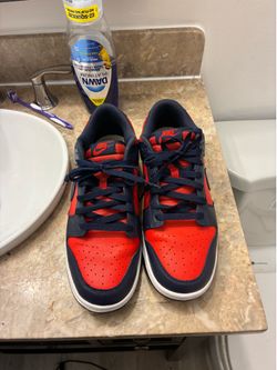 Nike Dunk Low Retro sneakers in a red and navy colorway