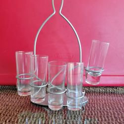 Set Of 5 Shot Glasses On A Silver Metal Rack