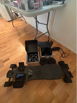 Evolve GTR Carbon Electric Skateboard w/ Extra Wheels, Belts, Remote & Accessories