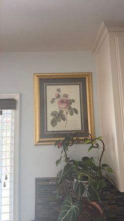Vintage gold frame with rose