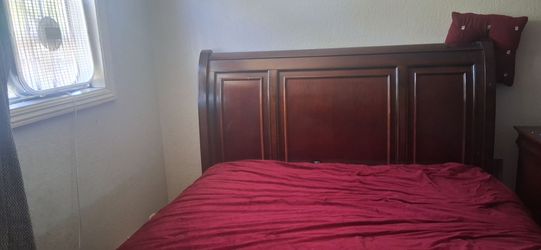 Queen size wooden bed frame and two wooden night stans