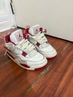 Air Jordan 4 White and Red Sneakers