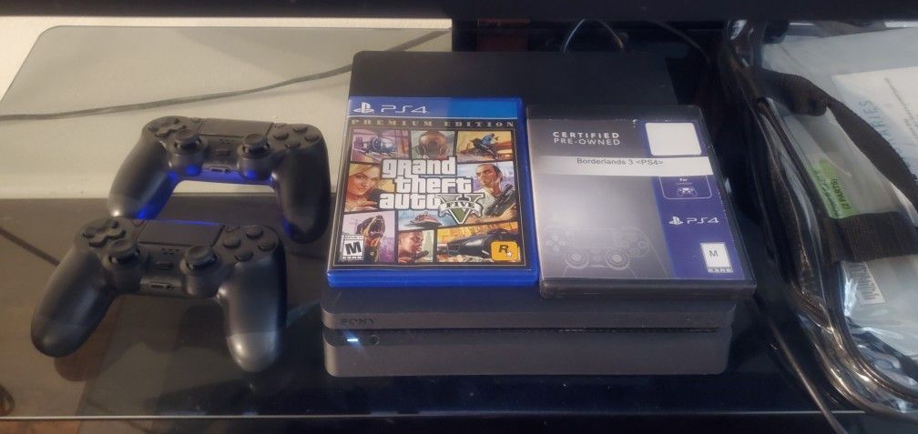 PS4 Slim With 2 Controllers And 2 Games
