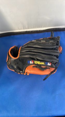 black and tan leather Wilson baseball glove