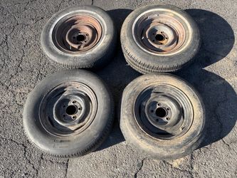 15 inch Chevy or GMC truck or van rims and old tires 5 on 5 steelies