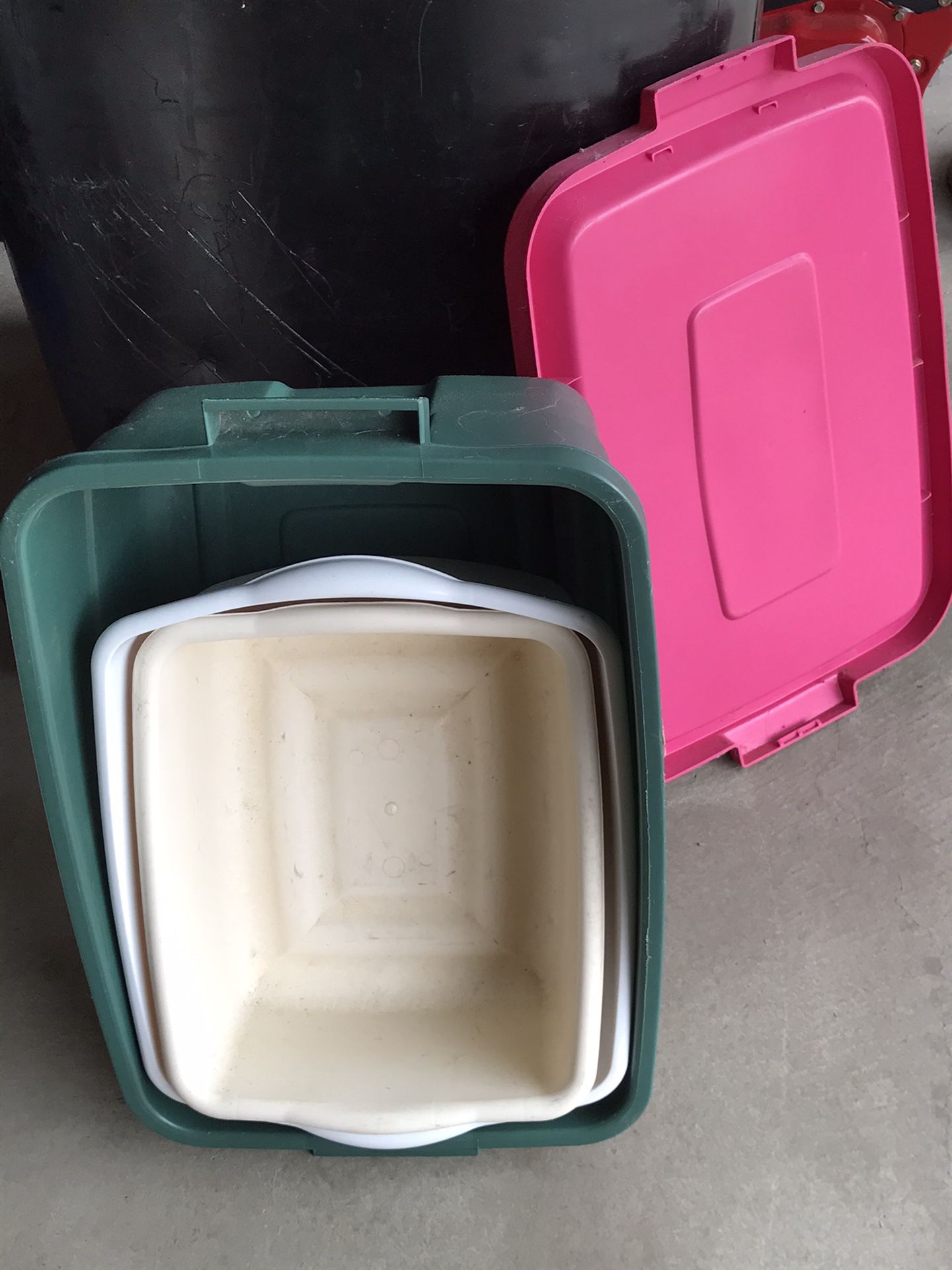 One Rubbermaid storage container and two plastic containers