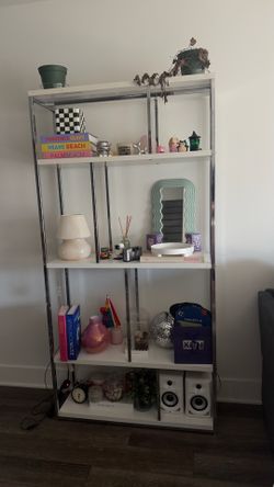 White bookshelf with chrome details