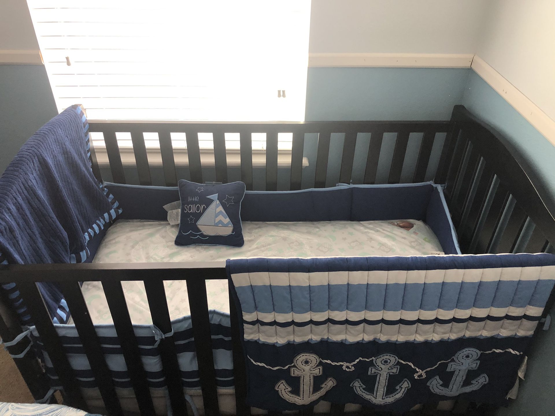 Crib and baby changing table