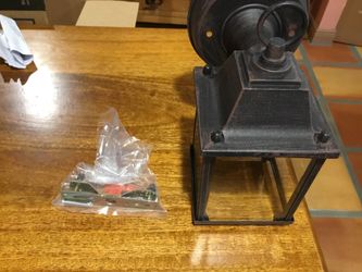 I have two porch lights still in box never used. Cool bronze color.