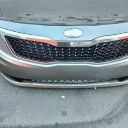 2011-2013 Kia Optima Front Bumper (Complete) With Grill And Emblem And Fog Lights.