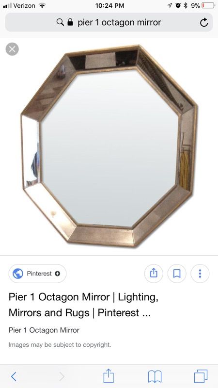 Pier 1 Imports octagon shaped mirror with gold frame.