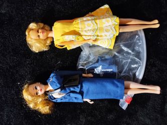 Vintage Francie and reproduction Barbie both in vintage outfits American airlines
