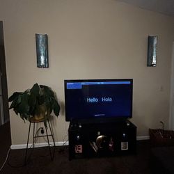 Living Room Tv Set Up With Candle Holders 