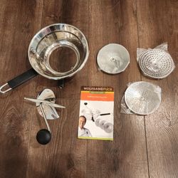 Wolfgang Puck Stainless Steel Food Mill with a bowl, hand crank, instruction manual, 3 interchangeable grinding discs. great condition