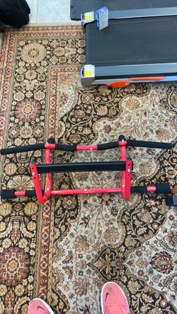 Pull-up bar for a door