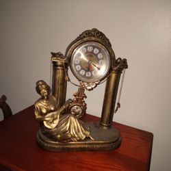 Antique Clock With Swinging Pendulum Arm