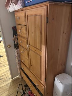 Brown armoire with Disney handles