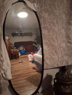 Elegant Oval mirror with iron stand