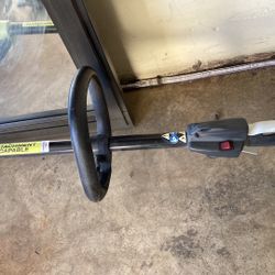 RYOBI FULL CRANK 2 CYCLE  Ryobi Expand-It attachment-capable outdoor power tool.