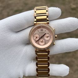 Coach women’s rose gold watch with diamond bezel