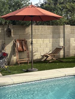 Umbrella And Wooden Recliner Chairs