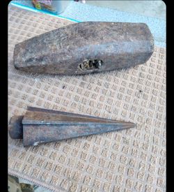 used 5 Lbs Construction Hammer Head and a used Pick of some sort