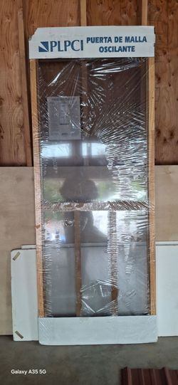 Unused wood screen door