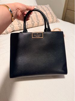 Very cute Kate Spade purse while taken care of