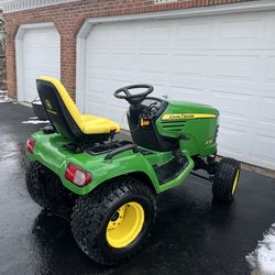 John Deere x728 4 wheel drive garden tractor with 27 HP Kawasaki liquid cooled engine