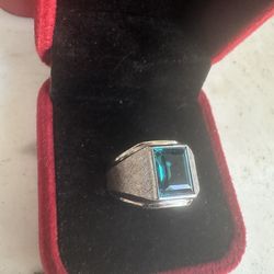 Beautiful 925 Sterling silver ring w/ blue emerald cut Cz stone , size 8, marked Sterling w/a symbol