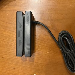 ID TECH MiniMag II magnetic stripe reader. This device is used to read data from the magnetic stripes on credit cards or other similar cards.