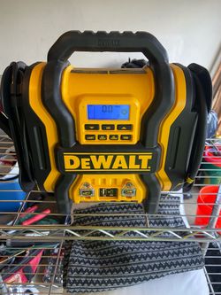 DEWALT DXAEJ14 1600 Peak Amp Portable Jump Starter with a 120 PSI digital air compressor and USB power bank.