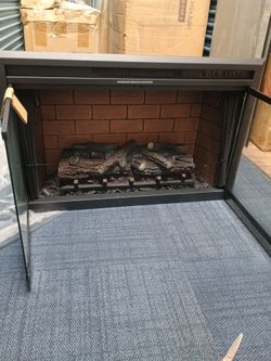 35 in x 23 in by 9 in fireplace brand new