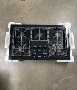 Black Kenmore Gas Stovetop