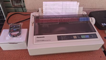 Panasonic KX-P1150 Multi-Mode 9-pin dot matrix printer. With box of 7 ink cartridges.