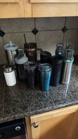 Assorted Stanley, travel coffee mugs, water bottles