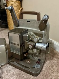 Vintage Bell & Howell Autoload 8mm film/movie projector with original hard carrying case.