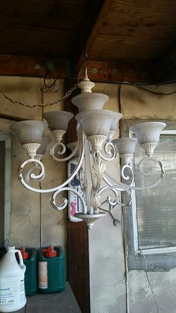 Heavy iron decorative hanging chandelier in an antique white