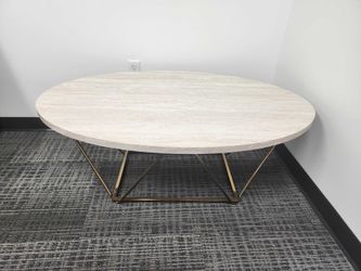 Oval Stone-Look Coffee Table - Gold Geometric Base, 47" Modern Glam