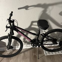 Pink and Black Mongoose 24-Inch Mountain Bike with Enhanced Comfort and Simplified Braking 