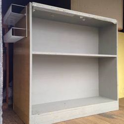 3 packing stands. Cutting board surfaces. Storage shelves.

