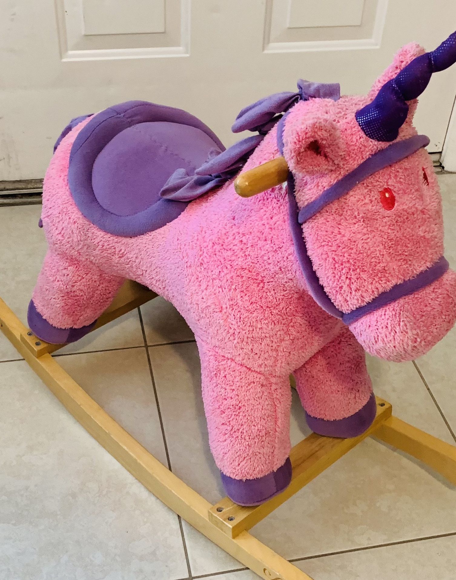 Pink and purple unicorn rocking horse