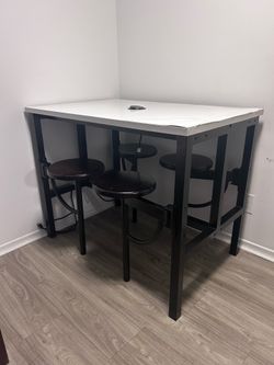 Bar Height Table with Attached Seating and Charging Station