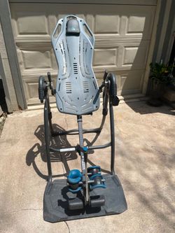 Teeter fits spine, inversion table