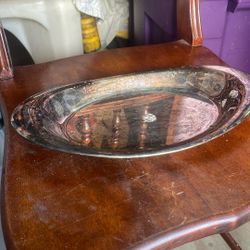 The item in the image is a vintage silver-plated serving dish or tray.